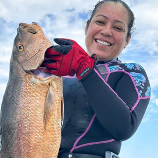 Leo with a Cubera on her second day spearfishing